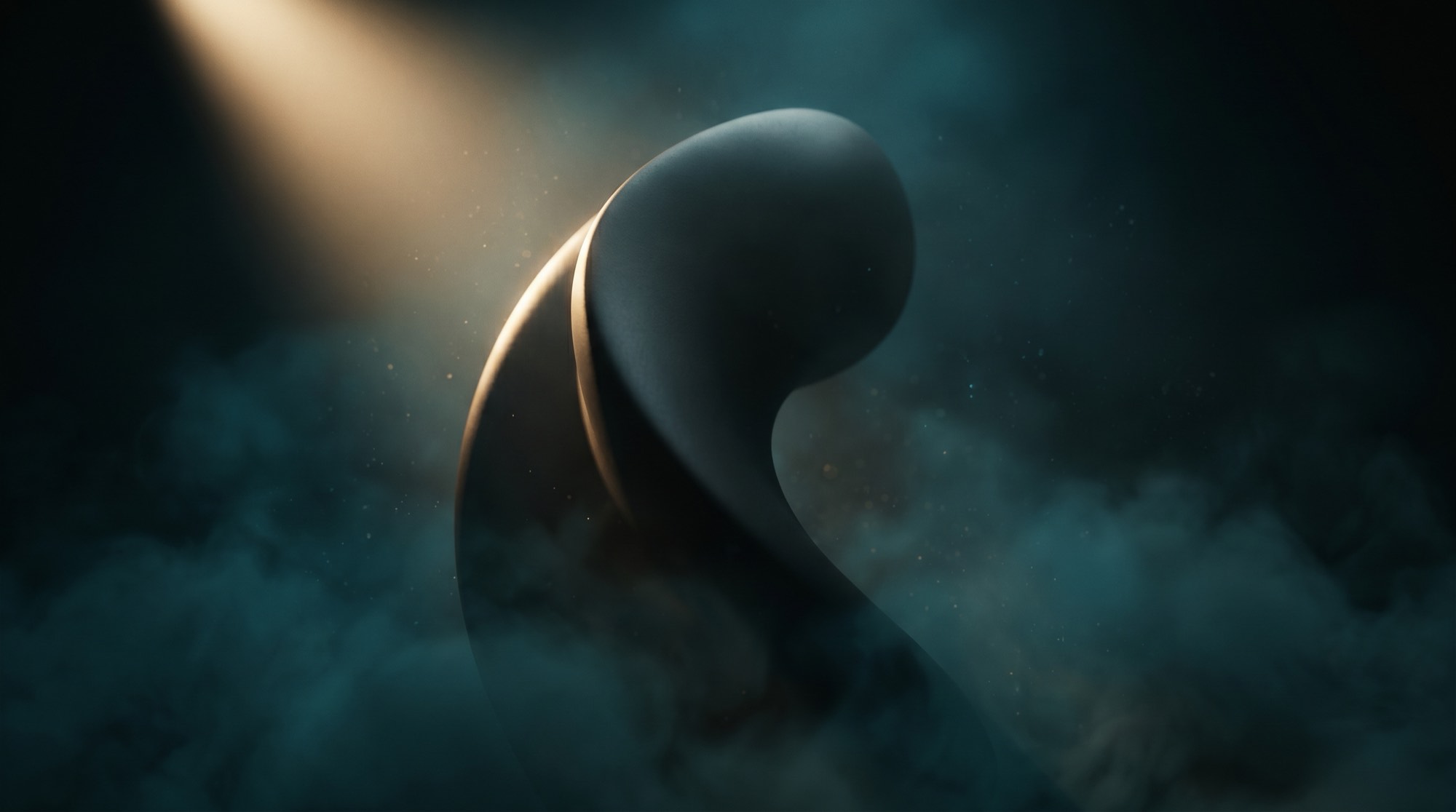 Sculptural form lit by warm light in deep teal fog